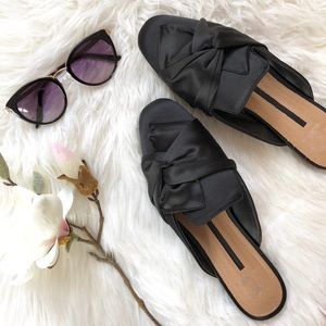 New Directions Black Mules in a silky fabric.